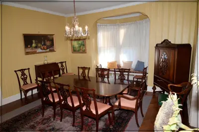 a dining room with a table and chairs at The White House in Plainfield