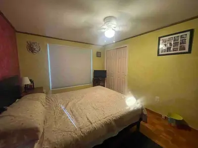a bedroom with a bed and a window with a blind at Most relaxing place on earth in Livingston Manor