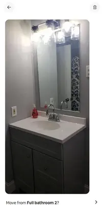 a bathroom with a sink and a mirror at Vdara Pocono Home in Tobyhanna