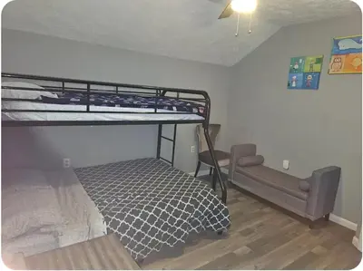 a bedroom with two bunk beds in a room at Vdara Pocono Home in Tobyhanna