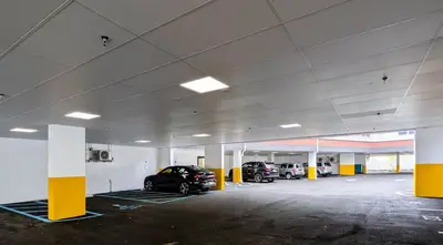 a parking garage with two cars parked in it at 224 Brand New 1 Bedroom 1 Bath 1 Kitchen 1 Liv in Dunellen