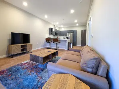 a living room with a couch and a table at 224 Brand New 1 Bedroom 1 Bath 1 Kitchen 1 Liv in Dunellen