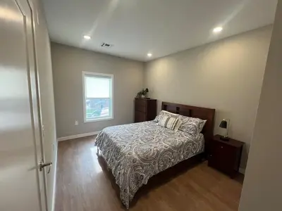 a bedroom with a bed and a window at 315 Brand New 1 Bedroom 1 Bath 1 Full Kit 1 Liv in Dunellen