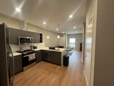 a kitchen with a sink and a stove top oven at 315 Brand New 1 Bedroom 1 Bath 1 Full Kit 1 Liv in Dunellen