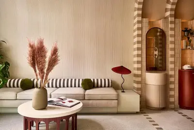 a living room with a couch and a table at Now Now NoHo in New York