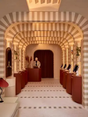 a large hallway with an archway in a building at Now Now NoHo in New York