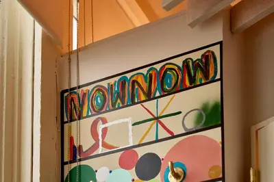 a painting on a wall in a room at Now Now NoHo in New York