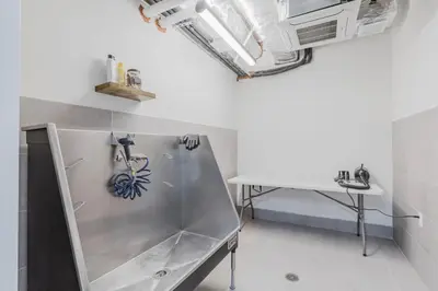 a bathroom with a shower and a table in a room at Blueground Jersey City gym wd ac games NYC-1580 in New York