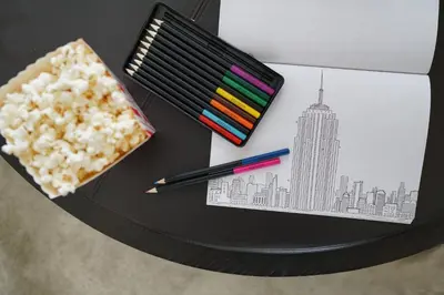 a table with pencils and a drawing of a city at The New York EDITION in New York