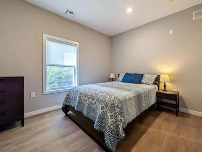 a bedroom with a bed and a window at 213 Brand New 3 Bedroom 2 Bath 1 Full Kit 1 Liv in Dunellen