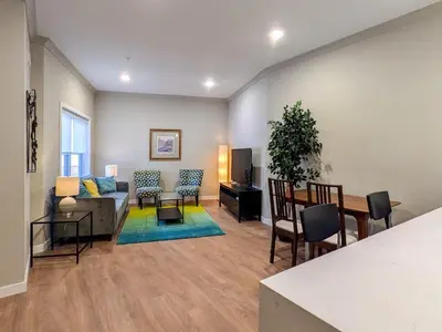 a living room with a couch and a table at 213 Brand New 3 Bedroom 2 Bath 1 Full Kit 1 Liv in Dunellen