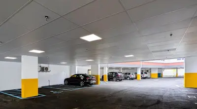a parking garage with two cars parked in it at 322 Brand New 2 Bdr 1 KIT 2 BTH 1 LIV in Dunellen