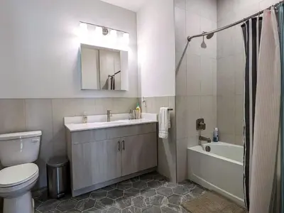 a bathroom with a toilet and a sink and a bath tub at 229 Brand New 1 Bedroom 1 Bath 1 Kitchen 1 Liv in Dunellen