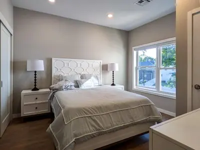 a bedroom with a large bed and a window at 210 Brand New 1 Bedroom 1 Bath 1 Full Kit 1 Liv in Dunellen