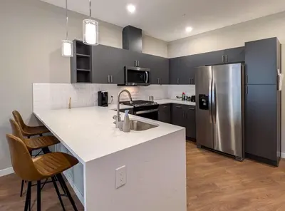 a kitchen with a stainless steel refrigerator and a counter at 210 Brand New 1 Bedroom 1 Bath 1 Full Kit 1 Liv in Dunellen