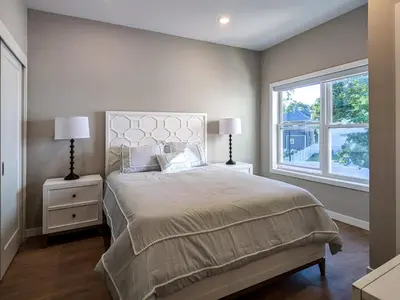 a bedroom with a large bed and a window at 210 Brand New 1 Bedroom 1 Bath 1 Full Kit 1 Liv in Dunellen