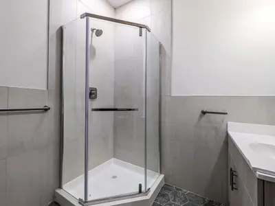 a shower with a glass door in a bathroom at 222 Brand New 2 Bedroom 1 KIT 2 BATH 1 Living in Dunellen