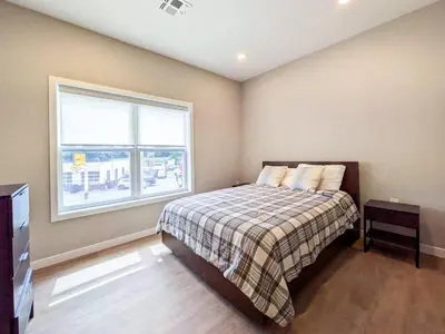 a bedroom with a bed and a window at 222 Brand New 2 Bedroom 1 KIT 2 BATH 1 Living in Dunellen