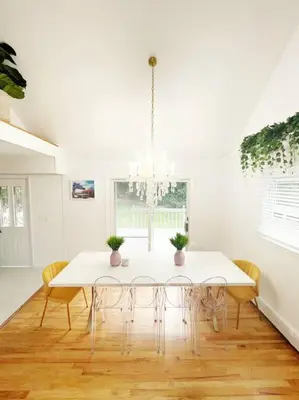 a white dining room with a white table and chairs at Luxe 10 guest Cottage Ski-Golf-Firepit-Lakes-Hike in Vernon Township