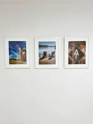 four frames of photos in a row on a wall at Luxe 10 guest Cottage Ski-Golf-Firepit-Lakes-Hike in Vernon Township