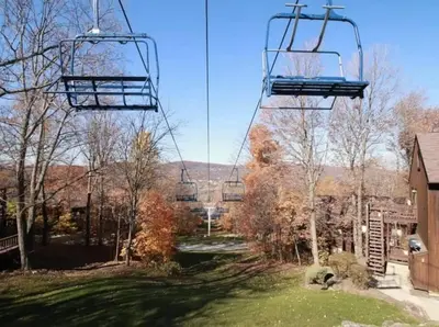 a gondola lift in a park with a yard at Luxe 10 guest Cottage Ski-Golf-Firepit-Lakes-Hike in Vernon Township