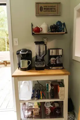 a shelf with a blender on it in a kitchen at Racc00ns Retreat in Lake Harmony