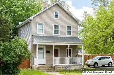 a house with a car parked in front of it at 107 Quaint Renovated Single Family 3 Bdrm House in Old Bridge