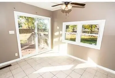 a living room with two windows and a ceiling fan at 107 Quaint Renovated Single Family 3 Bdrm House in Old Bridge