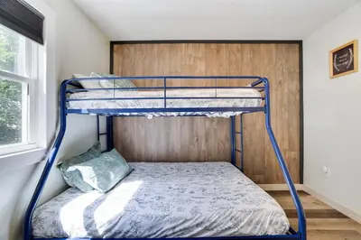 a bunk bed with a blue frame in a room at 2 Bedroom Condo in Tannersville - 6 Minutes from Camelback Mountain in Tannersville