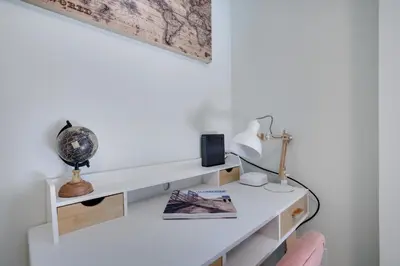 a white desk with a lamp and a book at 2 Bedroom Condo in Tannersville - 6 Minutes from Camelback Mountain in Tannersville
