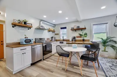 a kitchen with a table and two chairs and a table at 2 Bedroom Condo in Tannersville - 6 Minutes from Camelback Mountain in Tannersville