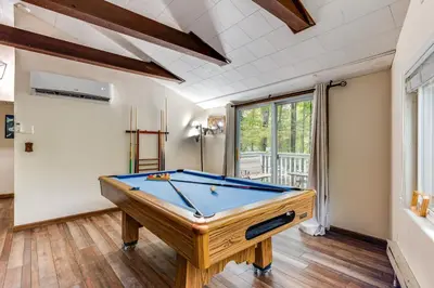 a billiard room with a pool table in it at Home with Hot Tub and Arrowhead Lake Community Perks! in Pocono Lake