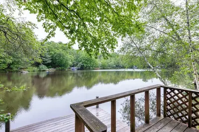 a view of a river from a wooden dock at Lakefront with Lots of Light and Private Dock Access in Ferndale