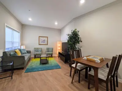 a living room with a couch and a table at 313 brand new 3 bedroom 2 bath in Dunellen