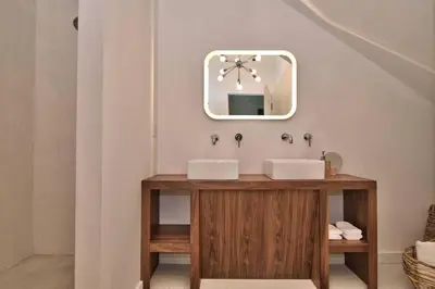 a bathroom with two sinks and a mirror at Wonder Honesdale -Loft A2 in Honesdale