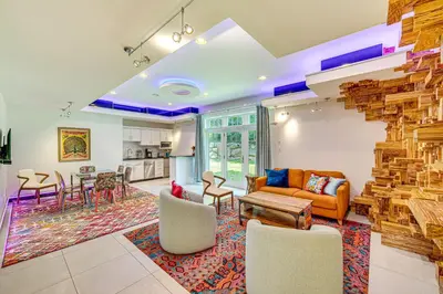 an open living room with a stone wall at The Grotto - Unique Interactive Cave Experience in Spring City
