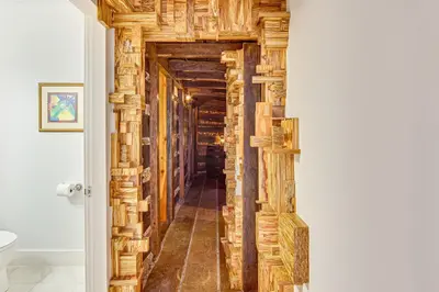 a hallway of a home with wooden walls at The Grotto - Unique Interactive Cave Experience in Spring City