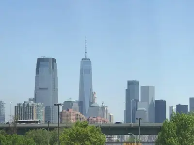 a city skyline with tall buildings in the distance at Private Apartment with NYC VIEWS right outside NYC in Jersey City