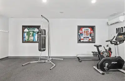 a room with a gym with a treadmill and a bike at Magnificent 1BR with Pool & Gym in Philadelphia