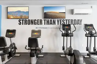 a gym with several exercise bikes in a room at Magnificent 1BR with Pool & Gym in Philadelphia
