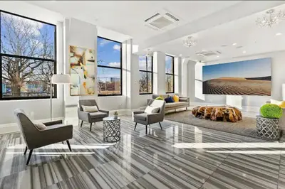 a living room with a couch and chairs and a table at Chic NoLibs 1BR - Pool & Gym in Philadelphia