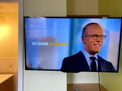 a tv screen with a picture of president obama on it at 3-bedrooms Journal Square near NYC in Jersey City