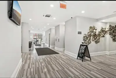 a hallway with a room with a bunch of balloons on the wall at Modern NoLibs 1BR - Pool & Gym in Philadelphia