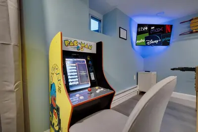 a childs room with a video game at Lakeview! - Close to Skiing - Includes Firepit & Game Room! in Arrowhead Lake