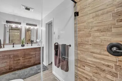 a bathroom with a shower and a sink at Nature's Paradise with Hot Tub and Fire Pit in Lake Harmony