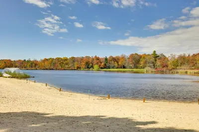 a view of a lake with trees in the background at Near Water Parks Pet-Friendly Tobyhanna Getaway! in Tobyhanna