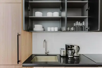 a kitchen with a sink and a counter top at Blueground Midtown West gym doorman wd NYC-1560 in New York