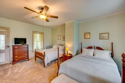 a bedroom with two beds and a ceiling fan at Walk to Creek Mount Joy Home with Peacocks On-Site! in Mount Joy