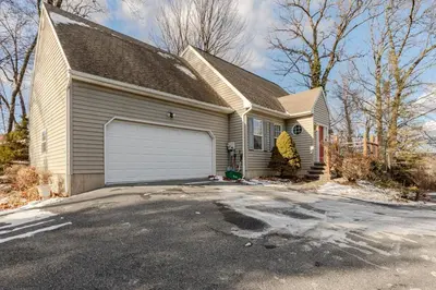 a house with a white garage at Mountain View-Steam Shower-2 Tier Patio- King Bed in Northampton