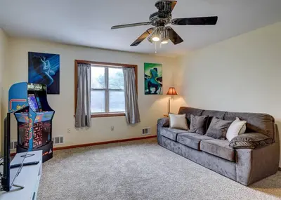 a living room with a couch and a ceiling fan at The Gap at Poconos- Sun Room-Arcade- Game Room in Long Pond